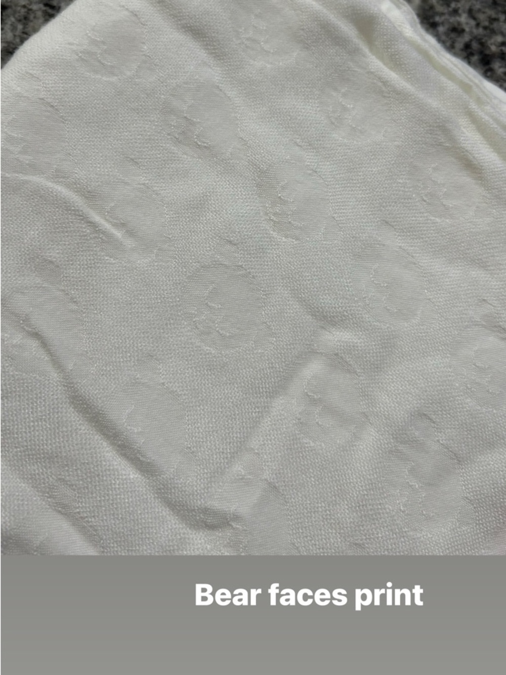 Tula White Baby Blanket with Embossed Bear Face Pattern
